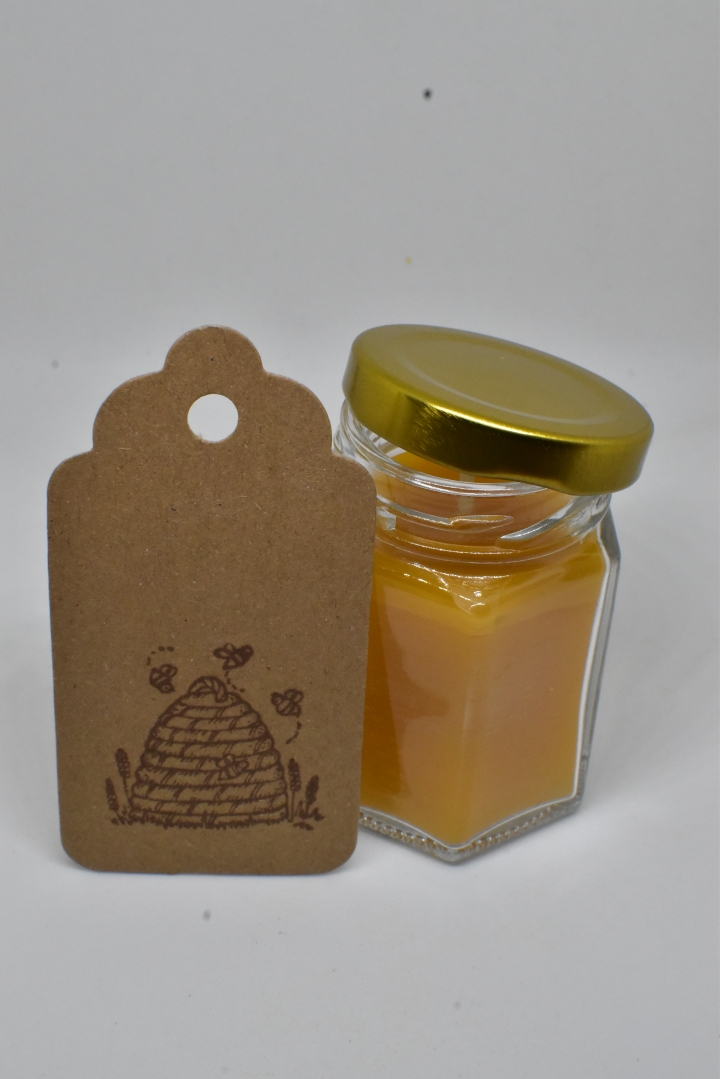 Handmade pure beeswax candle in glass jar